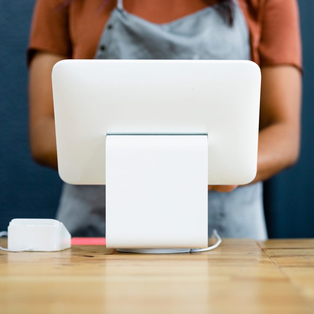 Small business owner at a cash register